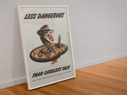 Less Dangerous Than Careless Talk Rattlesnake poster in a white frame leaning against a wall