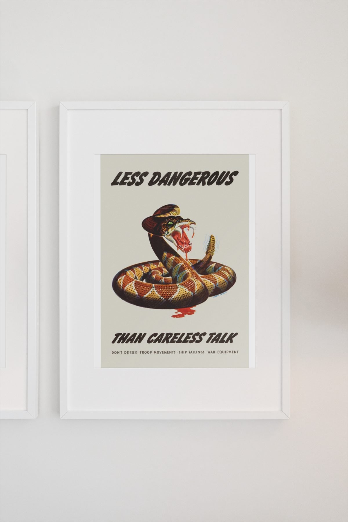 Less Dangerous Than Careless Talk Rattlesnake poster on a light wall