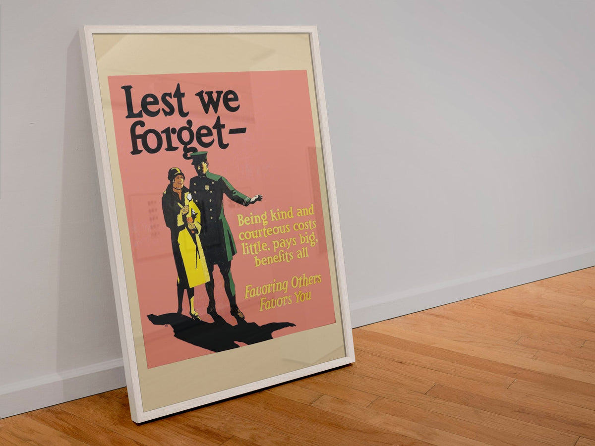 Lest We Forget poster in a white frame leaning against a wall