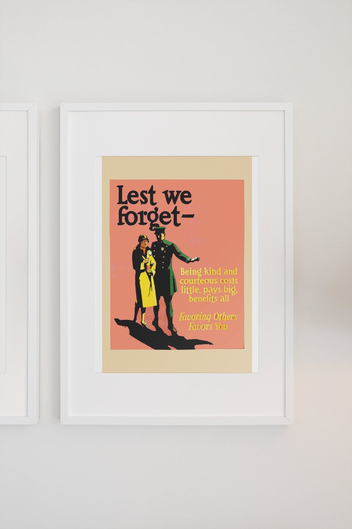 Lest We Forget poster in a white frame on a light wall