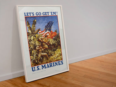 Lets Go Get Em US Marines poster in a white frame leaning against a wall
