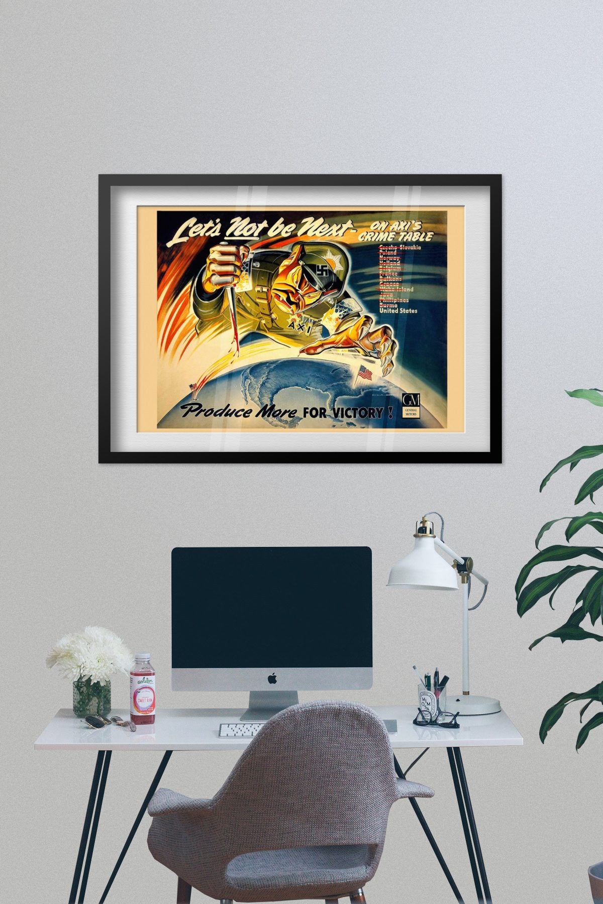 Lets Not Be Next on Axis Crime Table poster framed on a grey wall above a desk