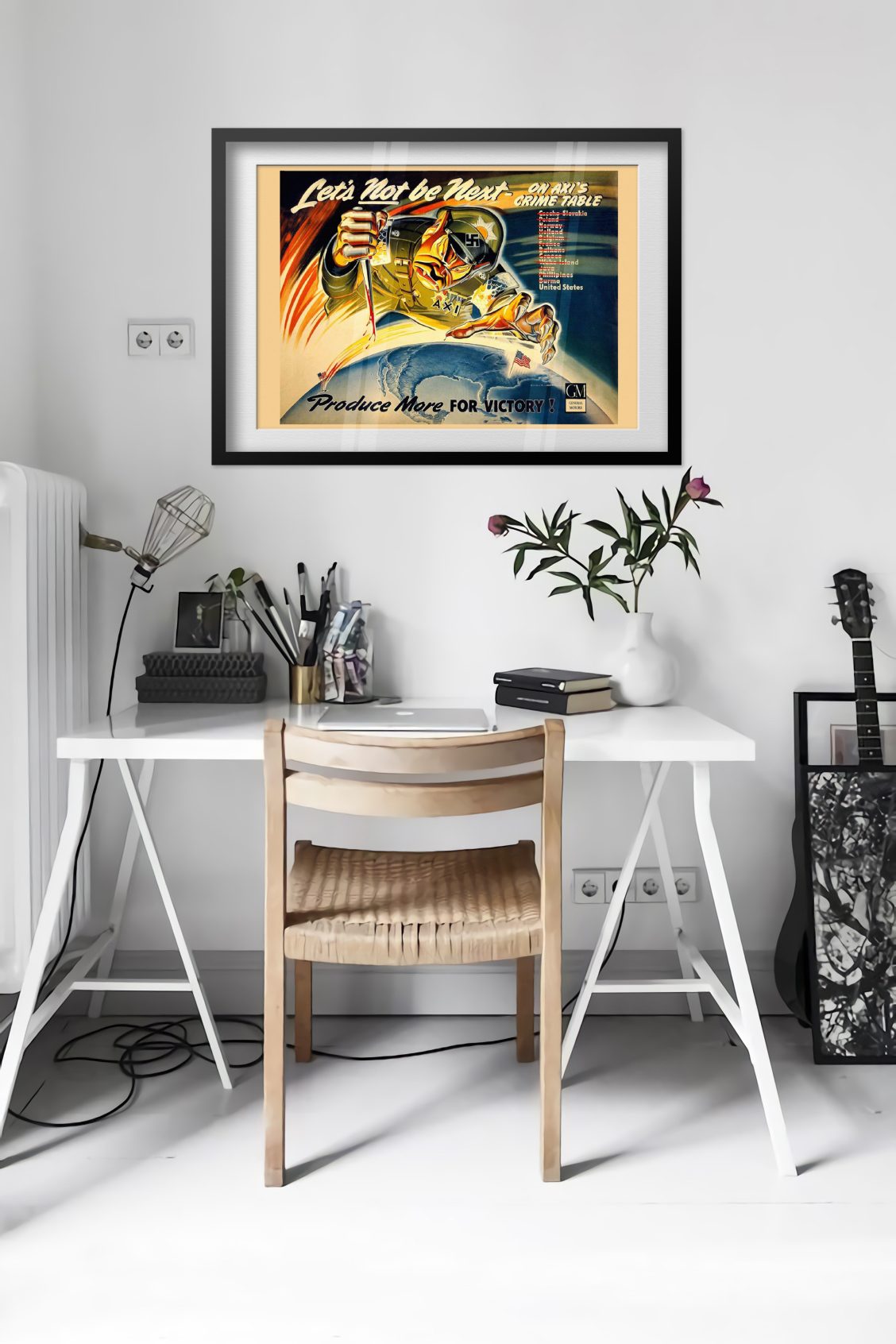 Lets Not Be Next on Axis Crime Table poster framed above a desk in a bright white room