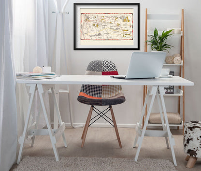 Lewis & Clark Trail Map print framed above a white desk in a home office