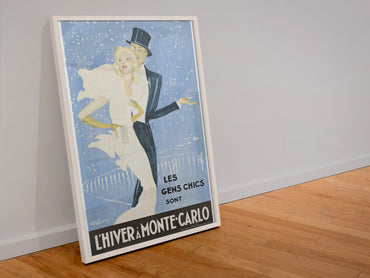 L Hiver a Monte-Carlo poster in a white frame leaning against a wall