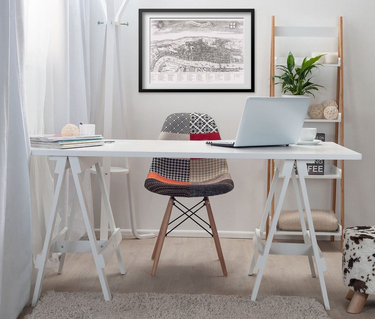 London 1560 Map print framed above a white desk in a home office