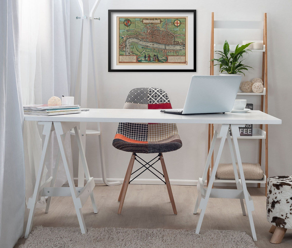 London 1561 Map print framed above a white desk in a home office