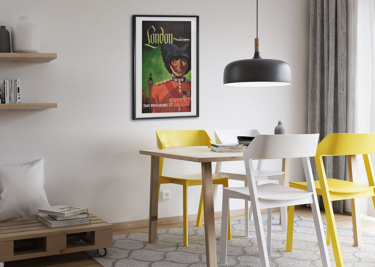 London Fly TWA Royal Guard poster framed above a dining table