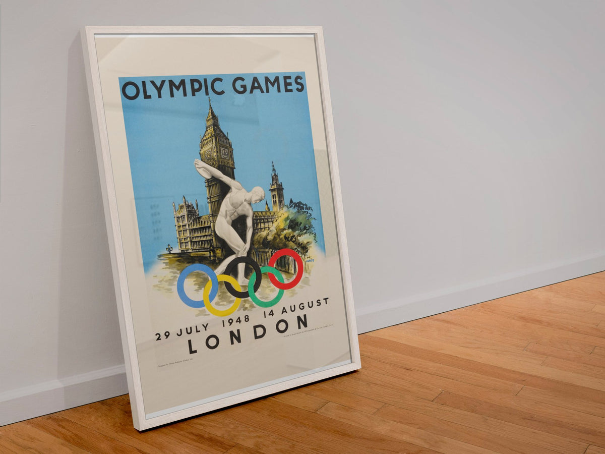 London Olympic Games 1948 poster in a white frame leaning against a wall