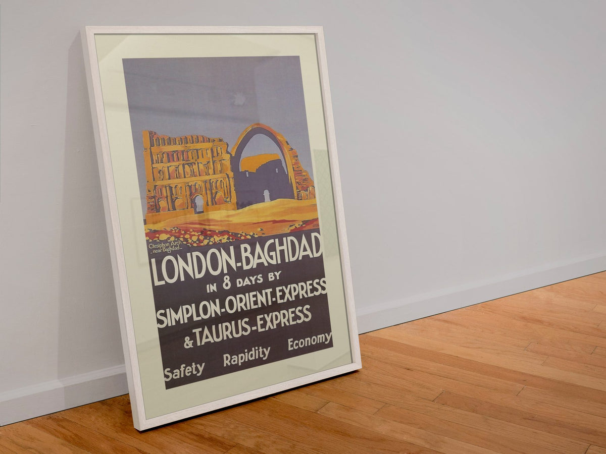 London to Baghdad Orient Express poster in a white frame leaning against a wall