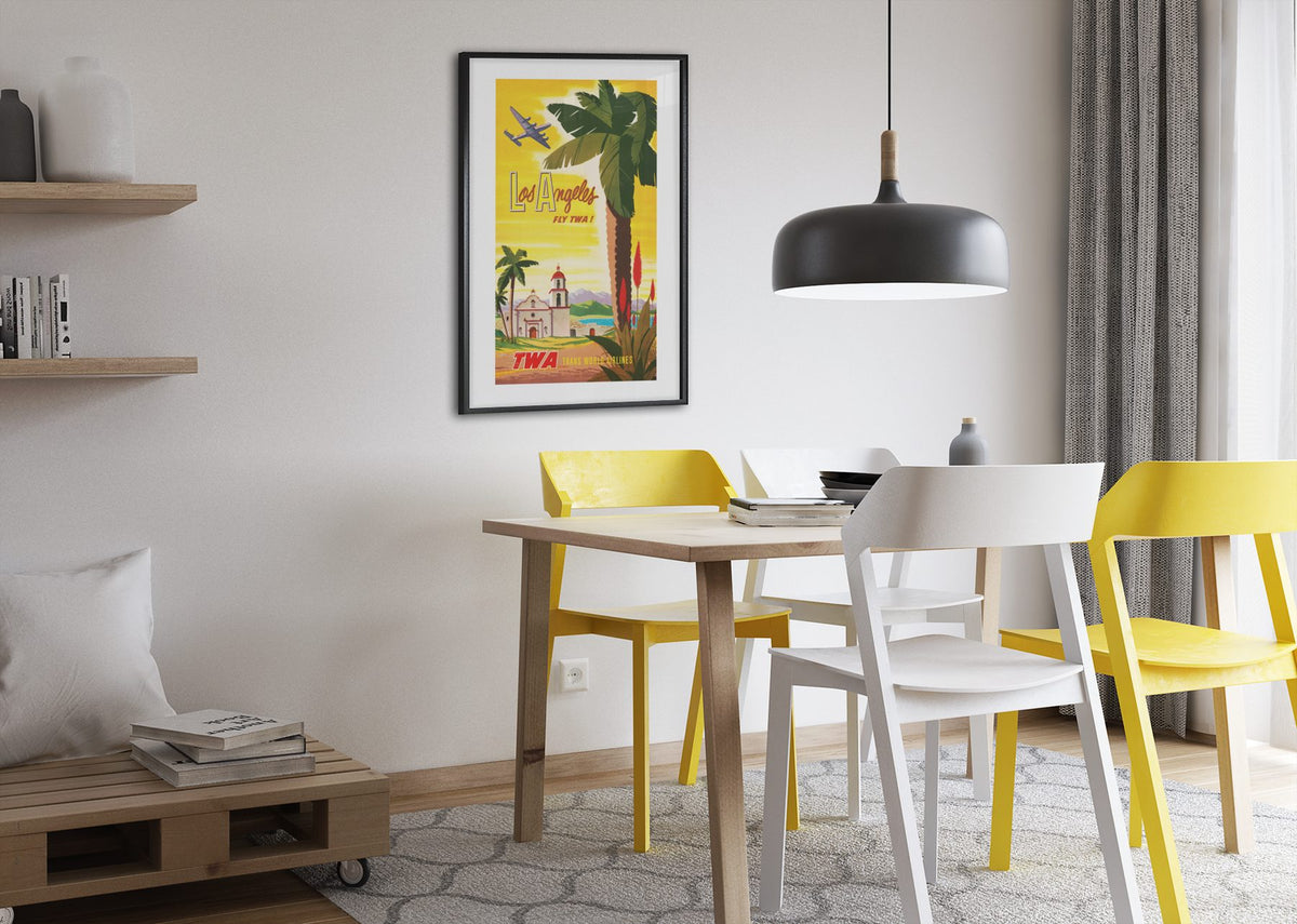 Los Angeles Fly TWA poster framed above a dining table