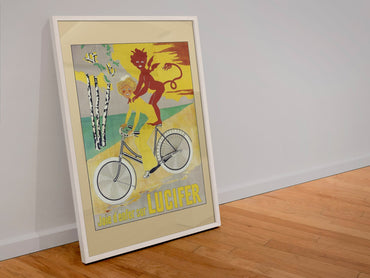 Lucifer Cycles Joie d Enfer poster in a white frame leaning against a wall
