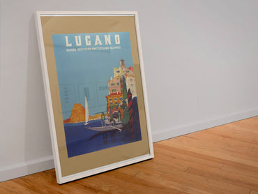 Lugano Southern Switzerland poster in a white frame leaning against a wall