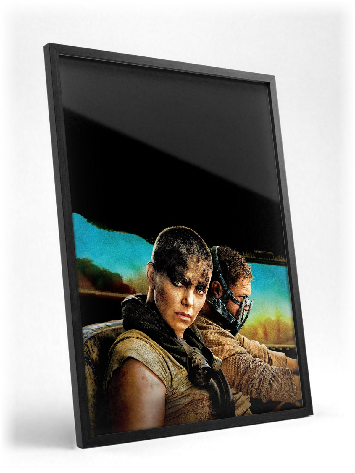 Mad Max: Fury Road (2015) Movie Furiosa and Max Portrait Art poster in a black frame with glass leaning against a wall