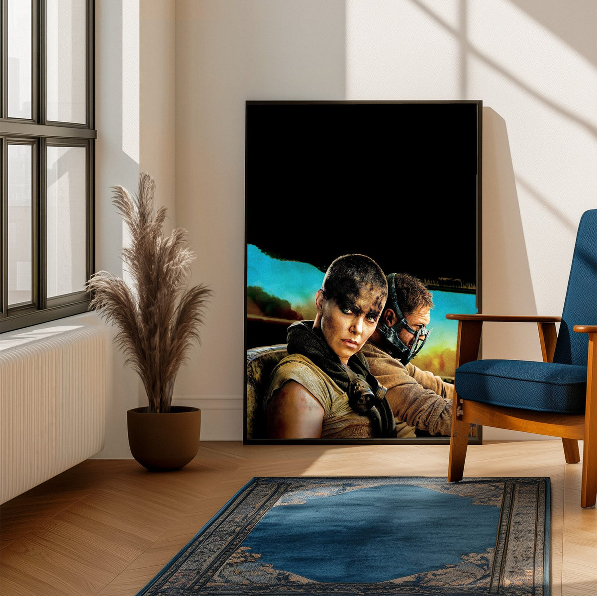 Mad Max: Fury Road (2015) Movie Furiosa and Max Portrait Art poster framed beside a blue armchair in a sunlit room
