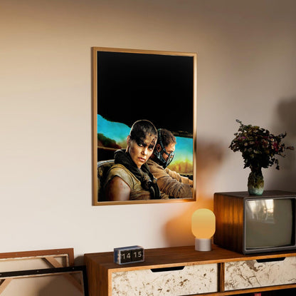 Mad Max: Fury Road (2015) Movie Furiosa and Max Portrait Art poster in an oak frame above a sideboard