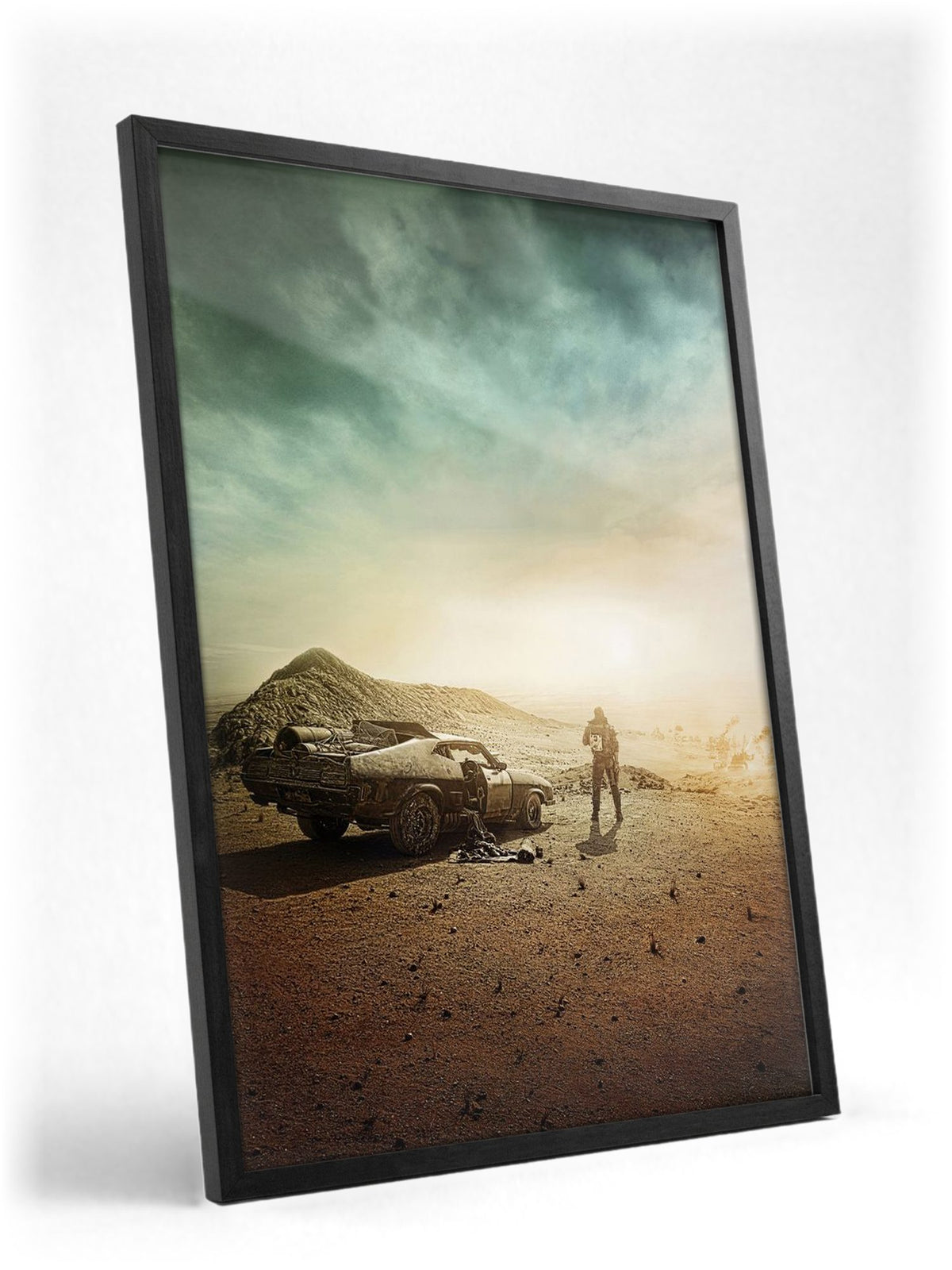Mad Max: Fury Road (2015) Movie Wasteland Art poster in a black frame with glass leaning against a wall