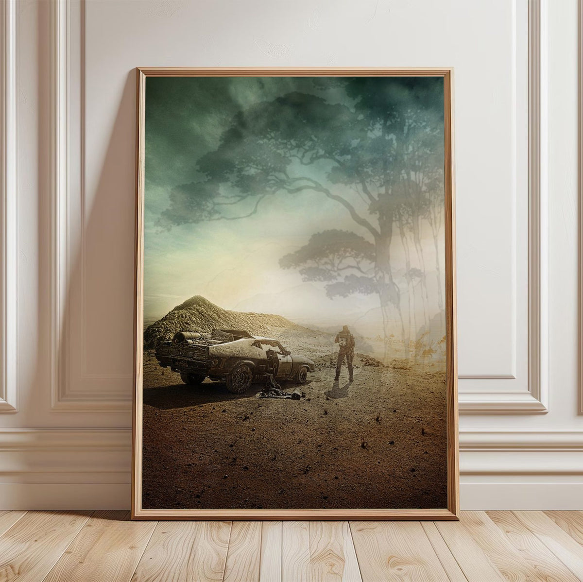 Mad Max: Fury Road (2015) Movie Wasteland Art poster in a light oak frame leaning against a white wall