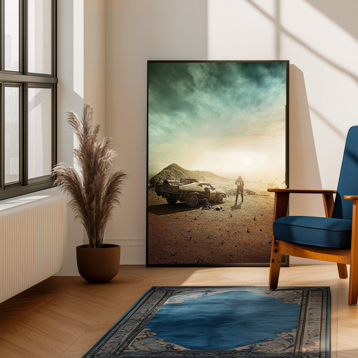 Mad Max: Fury Road (2015) Movie Wasteland Art poster framed beside a blue armchair in a sunlit room