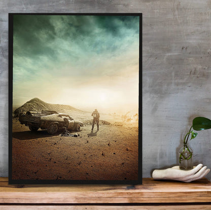 Mad Max: Fury Road (2015) Movie Wasteland Art poster in a black frame on a wooden shelf against concrete