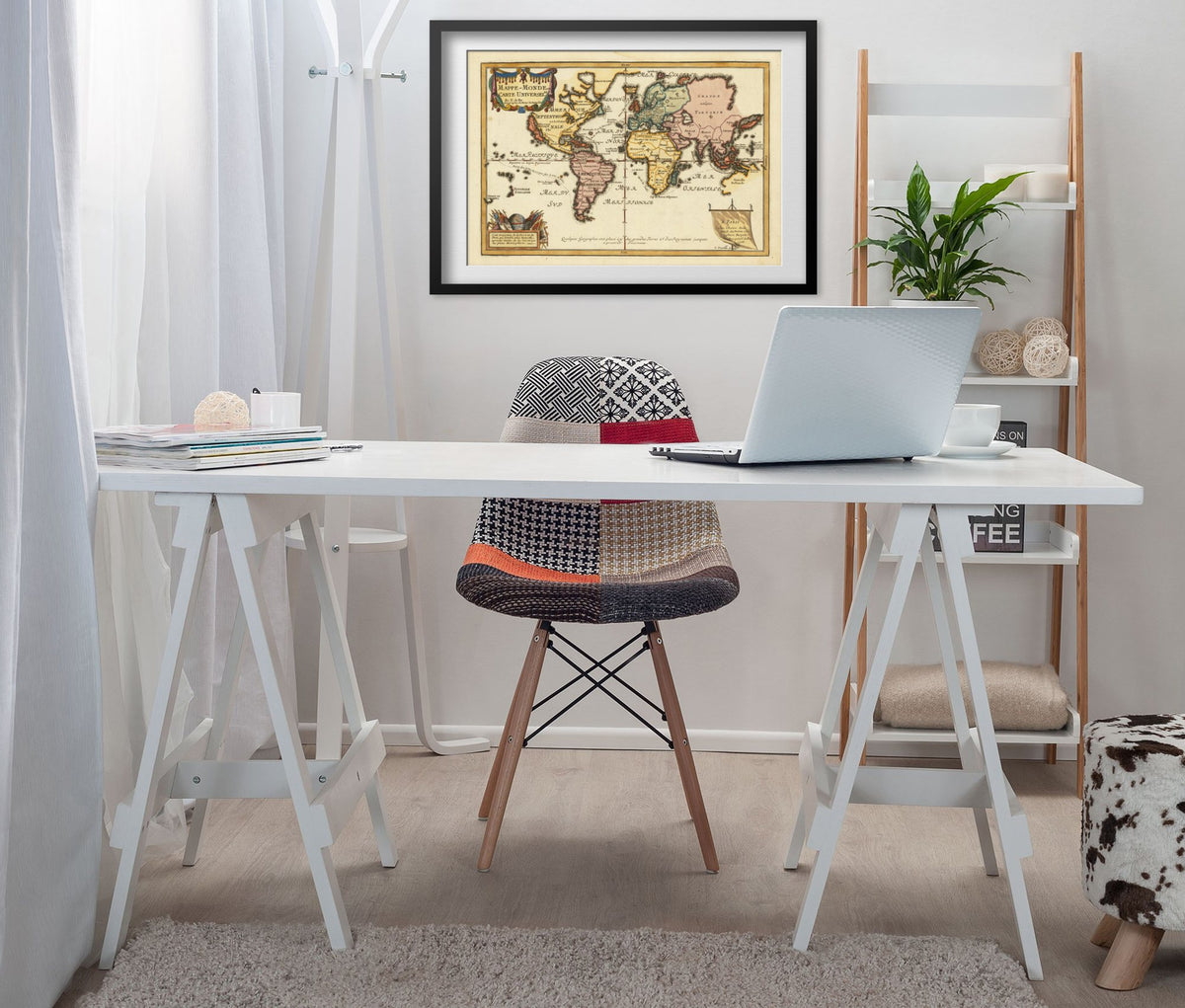 Map of the World 1700s framed above a white desk in a home office