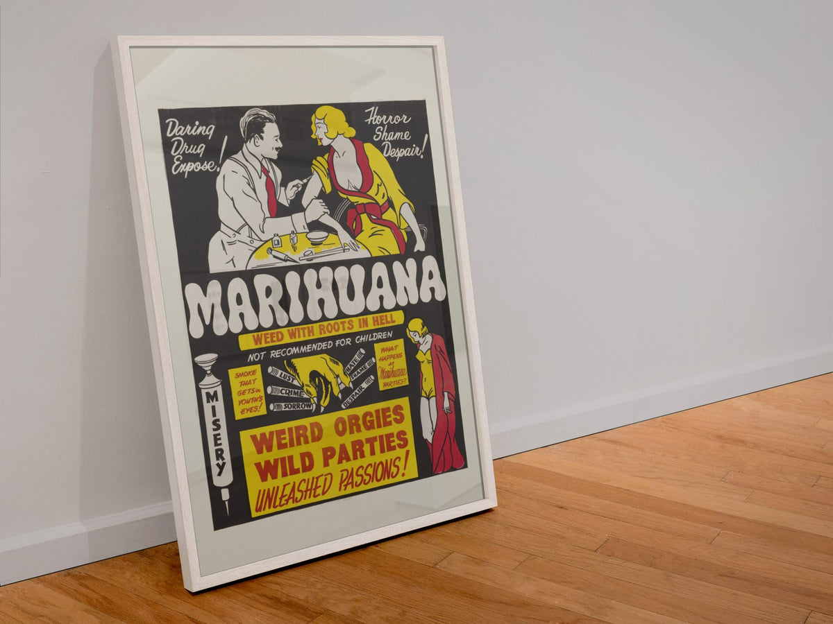 Marihuana Weed With Roots in Hell poster in a white frame leaning against a wall