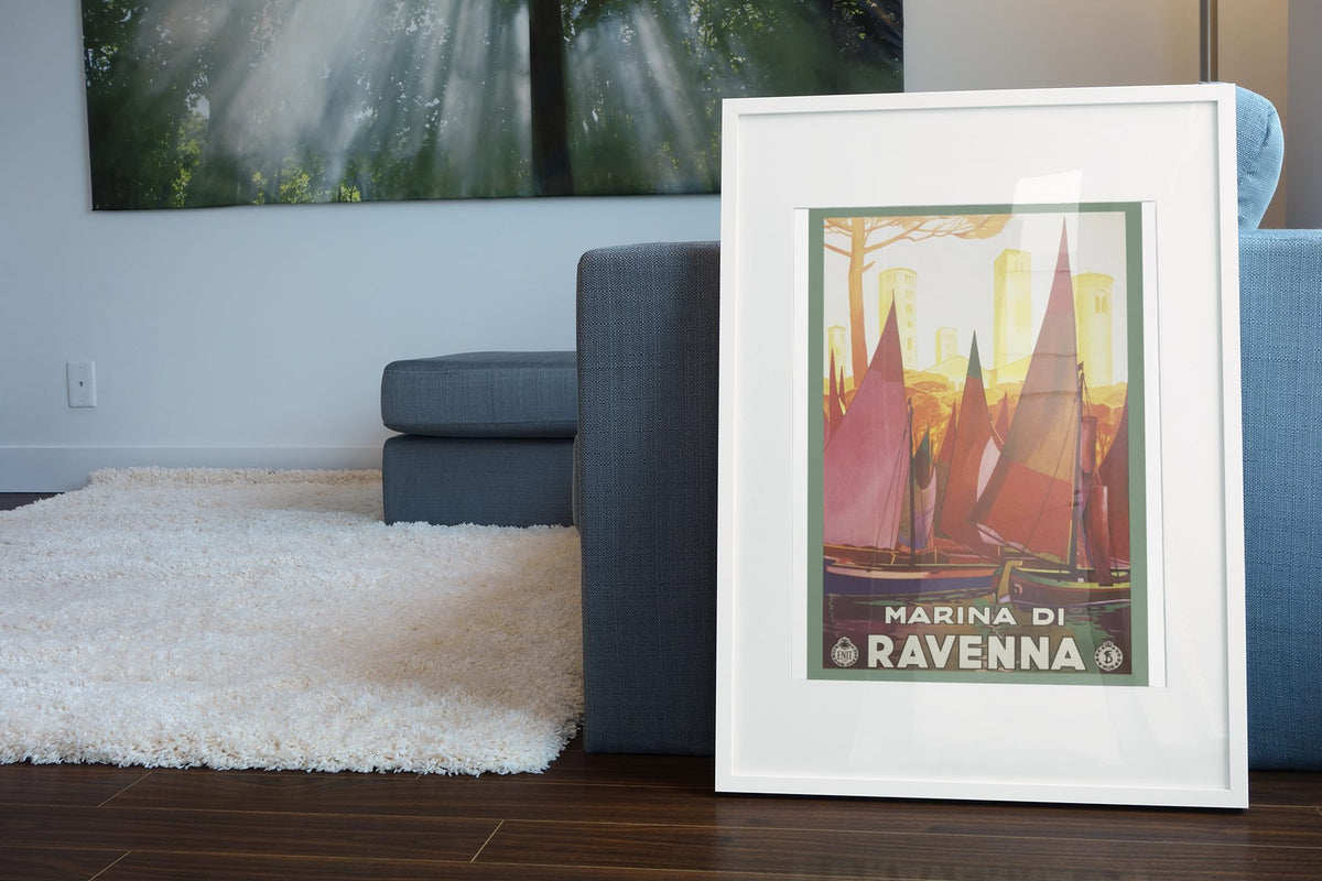Marina di Ravenna poster leaning beside a blue sofa