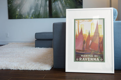Marina di Ravenna poster leaning beside a blue sofa
