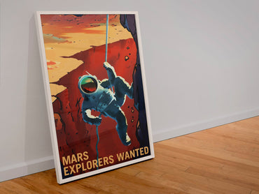 Mars Explorers Wanted poster in a white frame leaning against a wall