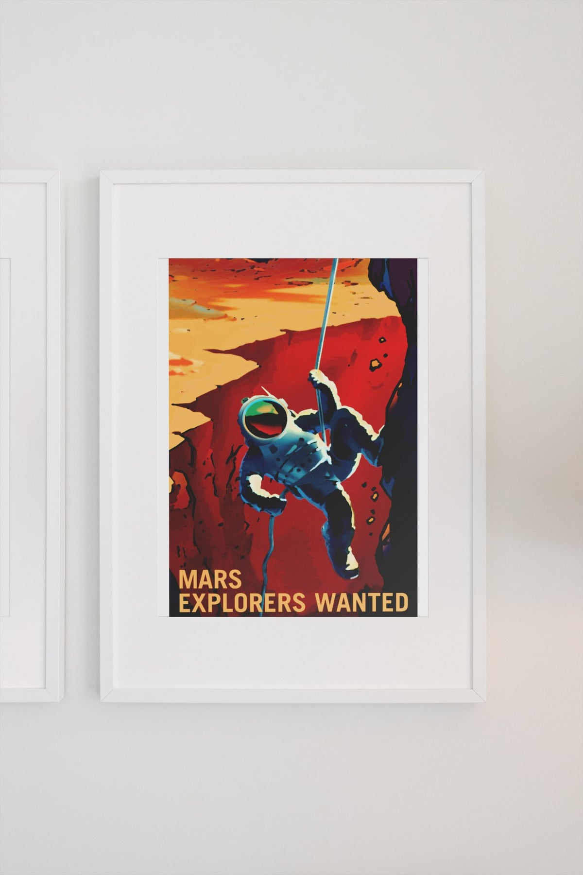Mars Explorers Wanted poster in a white frame on a light wall