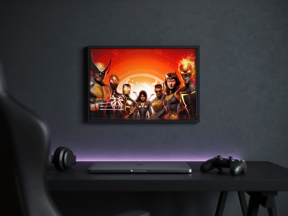 Marvel's Midnight Suns Digital Edition Key Art poster in a black frame above a gaming desk