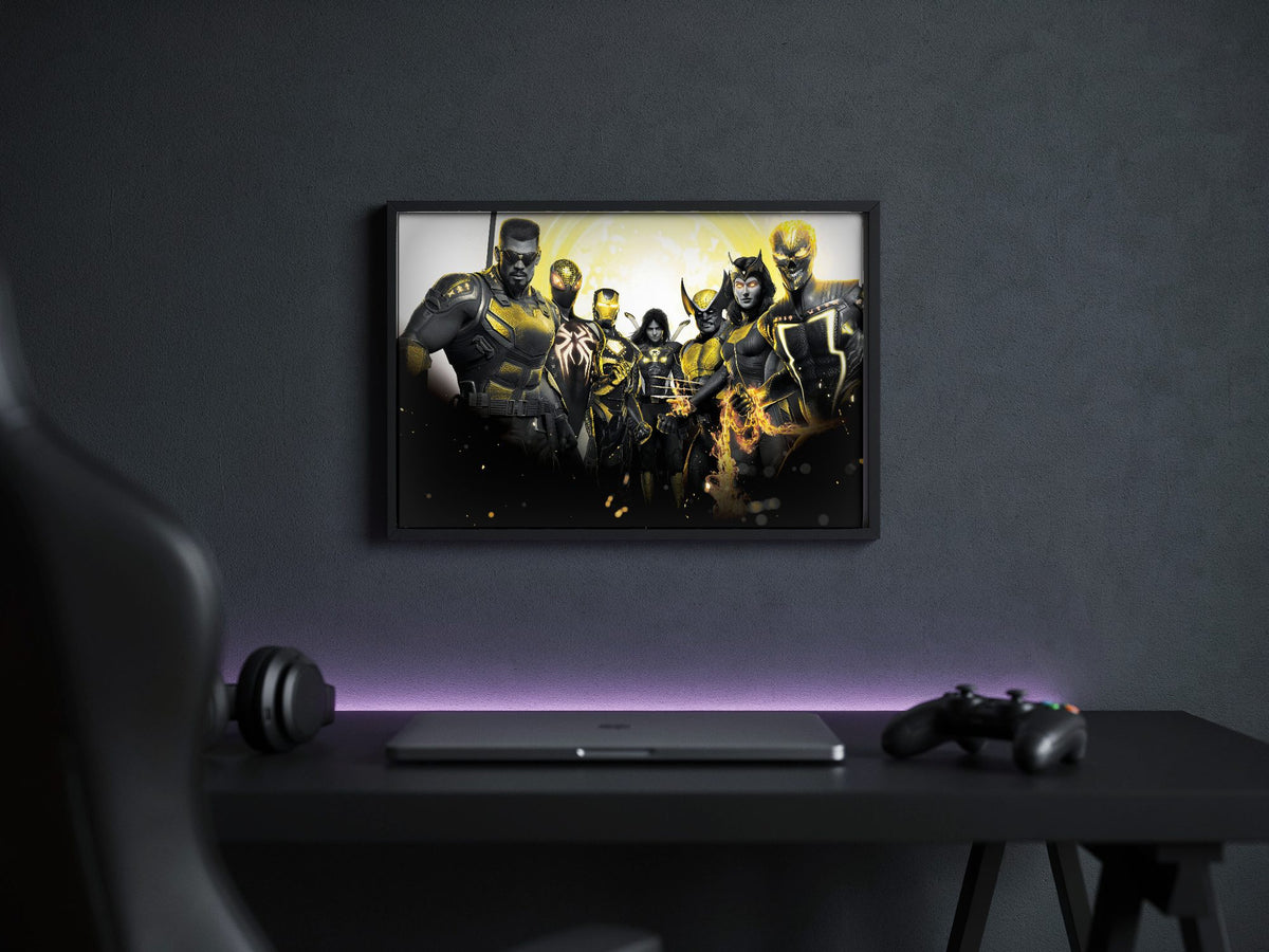 Marvel's Midnight Suns Enhanced Edition Key Art poster in a black frame above a gaming desk