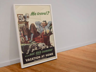 Me Travel Not This Summer Vacation at Home poster in a white frame leaning against a wall
