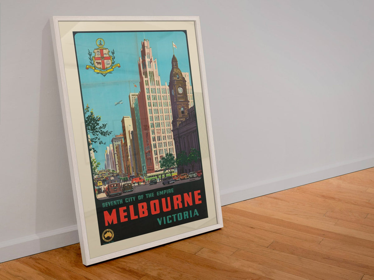 Melbourne Seventh City of the Empire poster in a white frame leaning against a wall