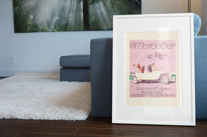 Mercedes Daimler poster leaning beside a blue sofa