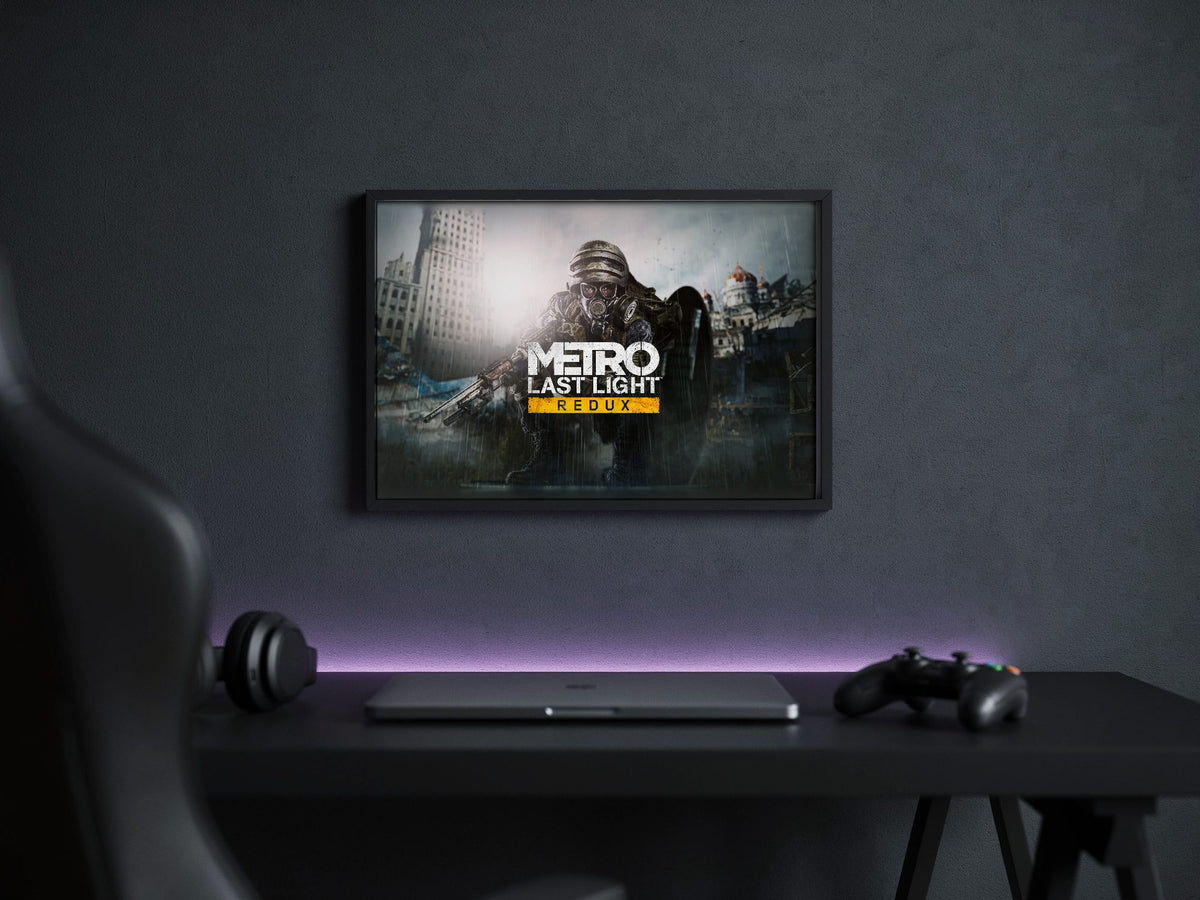Metro: Last Light Redux Wide Key Art poster in a black frame above a gaming desk