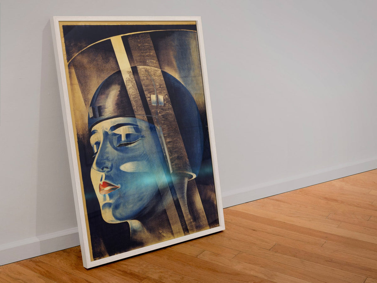 Metropolis poster in a white frame leaning against a wall