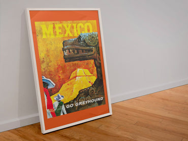 Mexico Go Greyhound poster in a white frame leaning against a wall