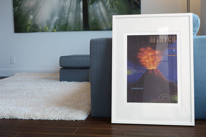 Mexico Paricutin Volcano poster leaning beside a blue sofa