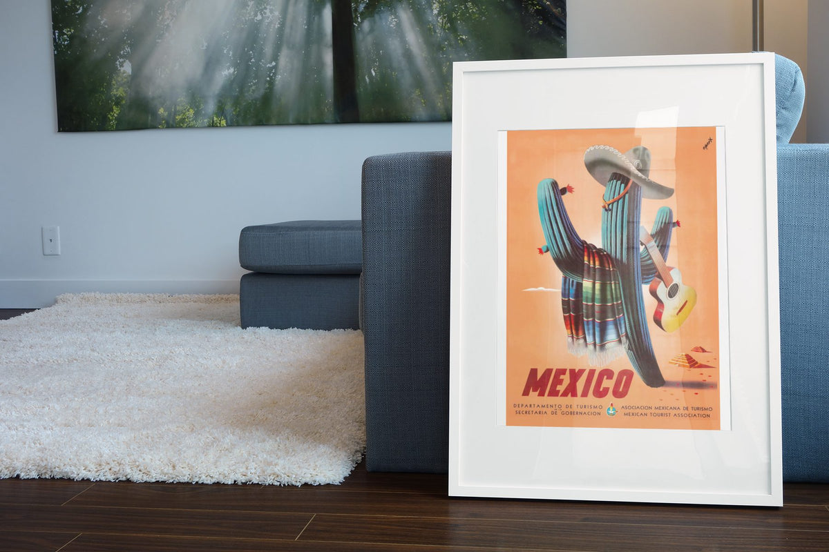 Mexico Saguaro Cactus poster leaning beside a blue sofa
