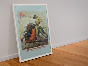 Mexico Bullfighter poster in a white frame leaning against a wall