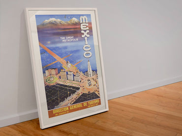 Mexico The Great Metropolis poster in a white frame leaning against a wall