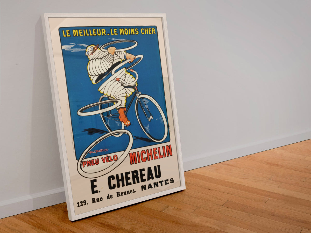 Michelin Pneu Velo Chereau poster in a white frame leaning against a wall