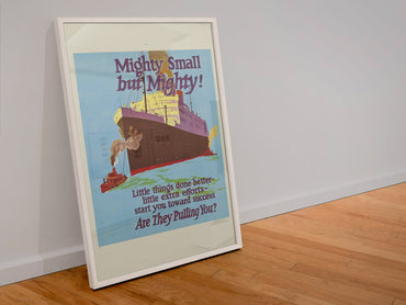 Mighty Small but Mighty poster in a white frame leaning against a wall