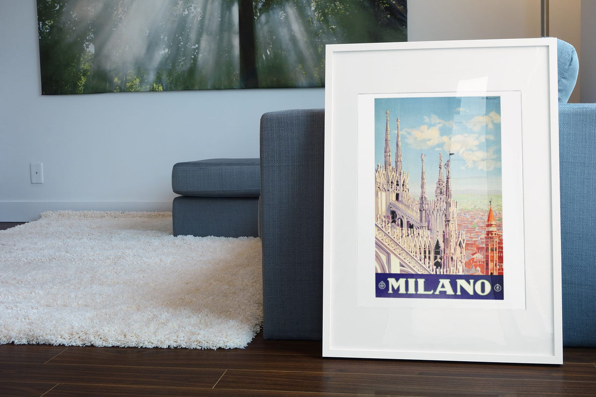 Milano Milan Cathedral poster leaning beside a blue sofa