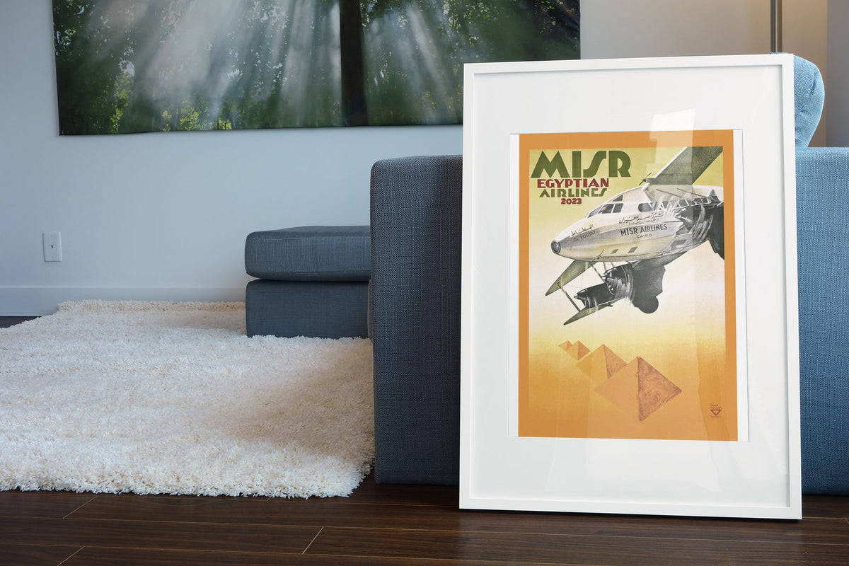 MISR Egyptian Airlines poster leaning beside a blue sofa