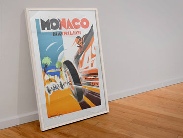 Monaco Grand Prix 1931 poster in a white frame leaning against a wall
