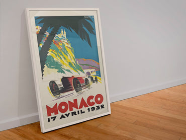 Monaco Grand Prix 1932 poster in a white frame leaning against a wall