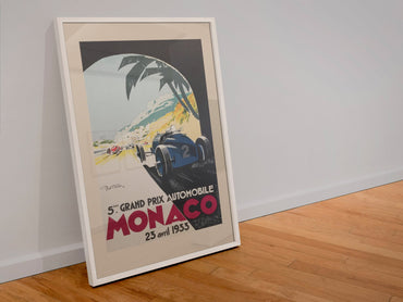 Monaco Grand Prix 1933 poster in a white frame leaning against a wall
