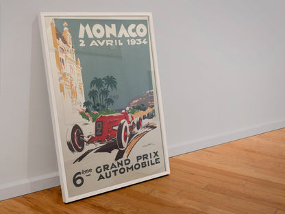 Monaco Grand Prix 1934 poster in a white frame leaning against a wall